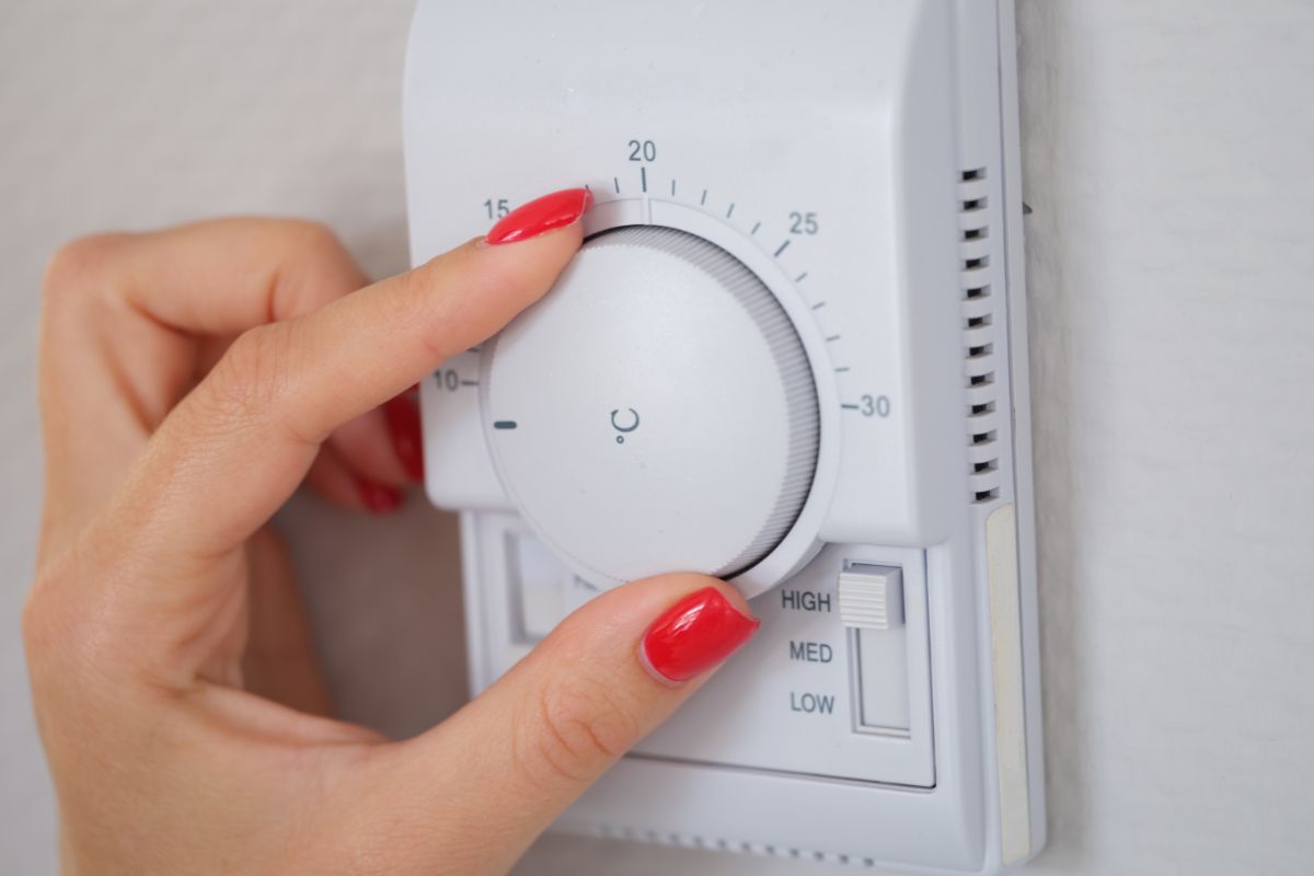 Manually adjust temperature in central heating control panel