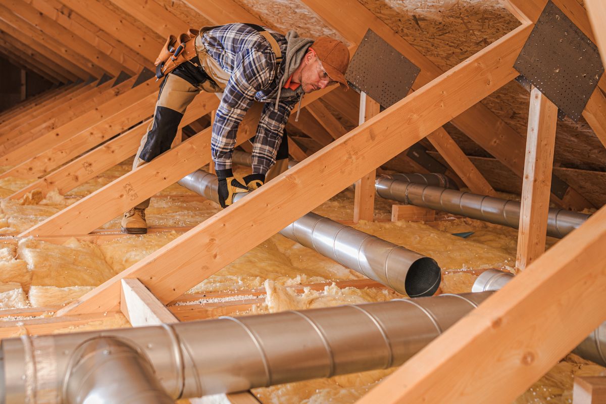 Air quality HVAC specialist installing new residential air duct