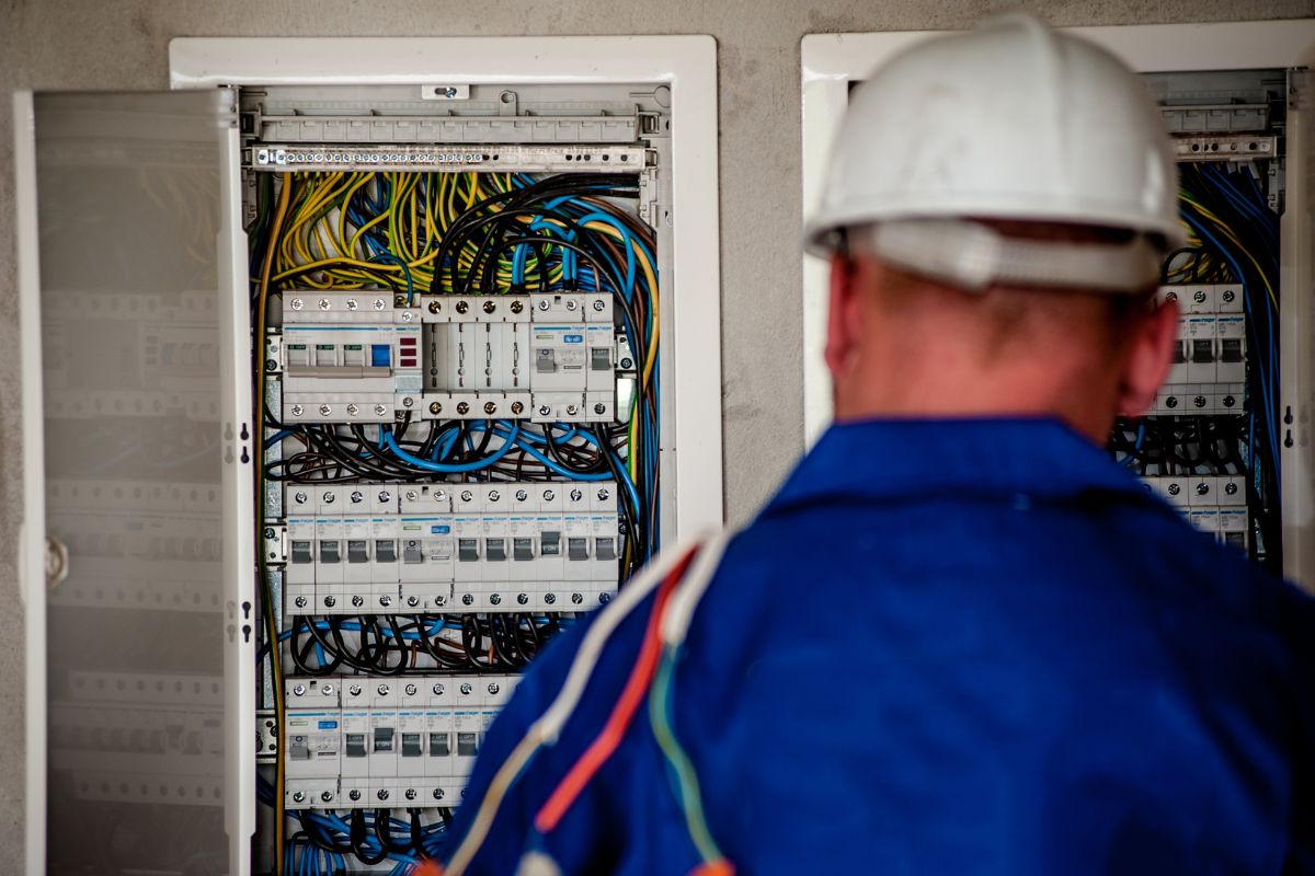 Electrician installing energy saving meter